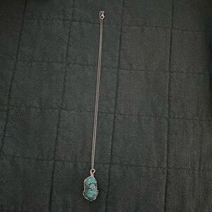 Turquoise wire wrapped necklace in sterling silver.